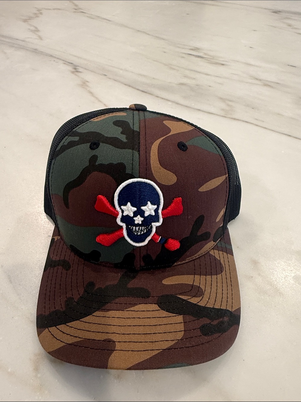 Camo Trucker Hat with Skull Patch red white and blue theme worn once